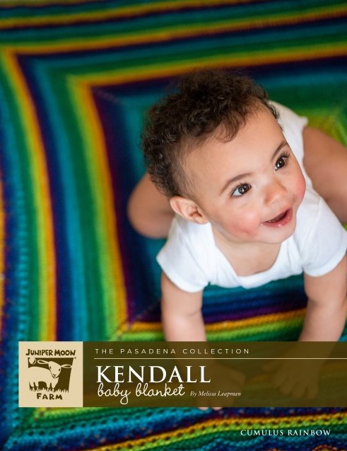 Juniper Moon Kendall baby blanket with smiling baby