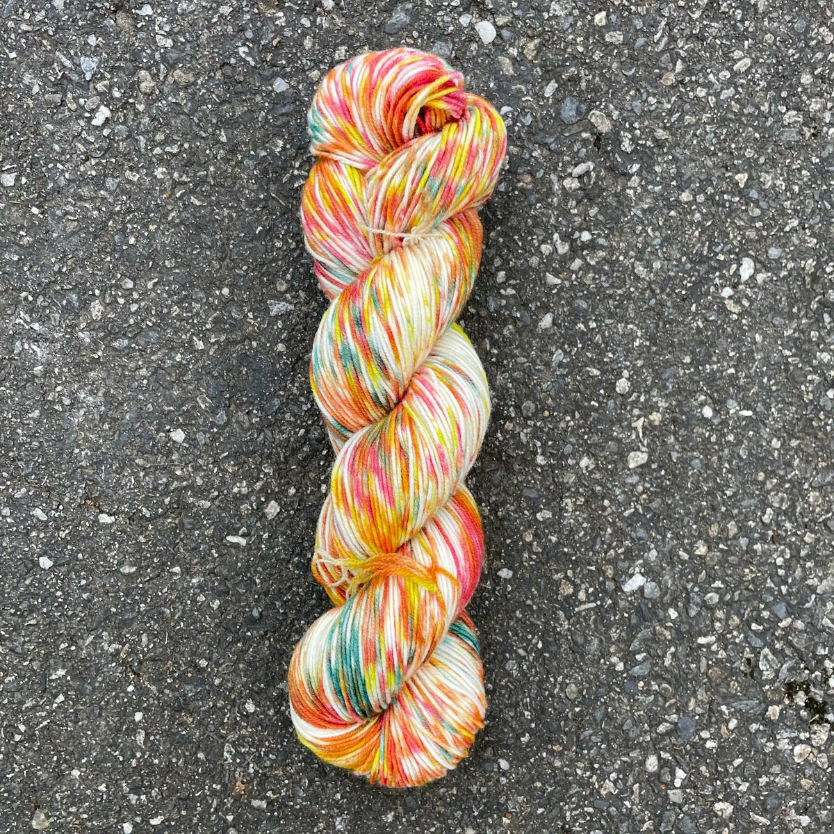 California Poppy colorway skein, Round Mountain Fibers Alder Fingering yarn