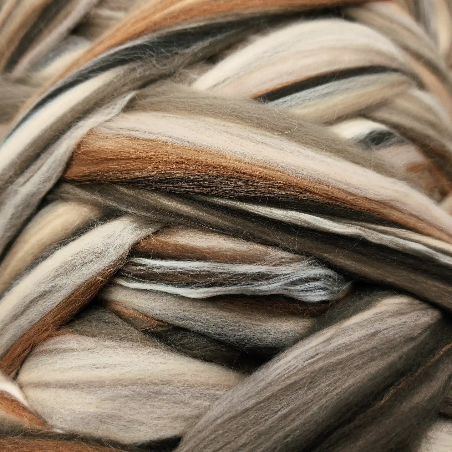 Close up of Chocolate Malt Sand Silk blend top showing sand mulberry silk reading tone on tone with the merino