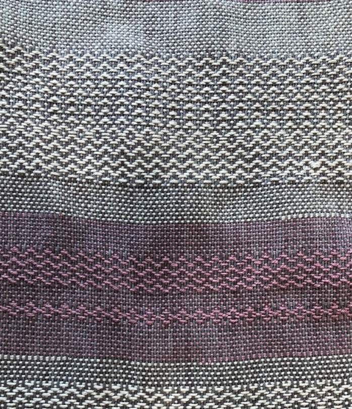 Gray and purple woven sample with decorative pattern bands