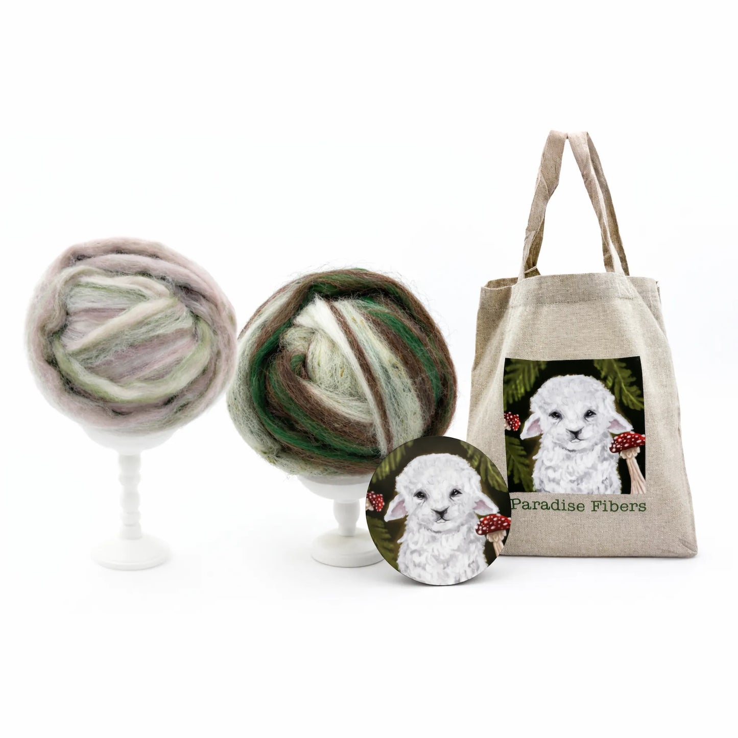 March Fiber Club, showcasing two fiber blends, a tote bag, and a sticker
