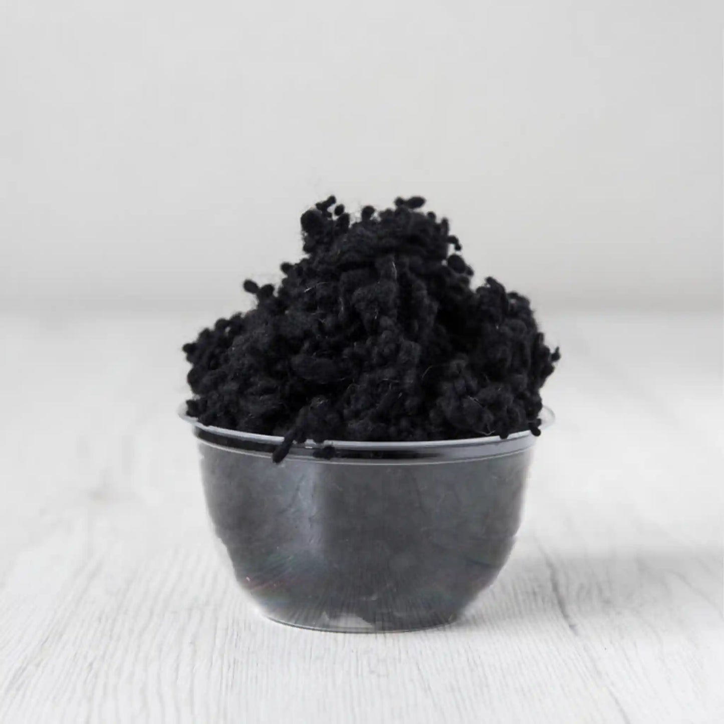 Merino wool nepps in Dark, small entangled fiber balls