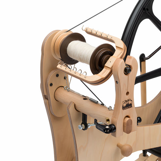 Closeup shot of the Schacht Flatiron Spinning Wheel Flyer and Mother of All