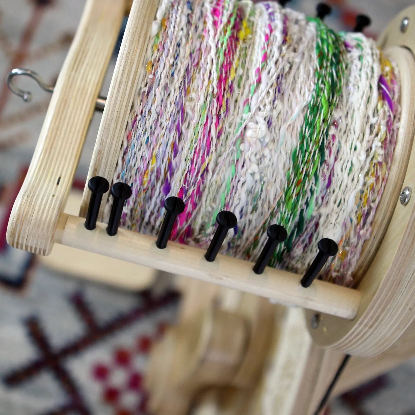 multicolored yarn on a very large spinolution bobbin