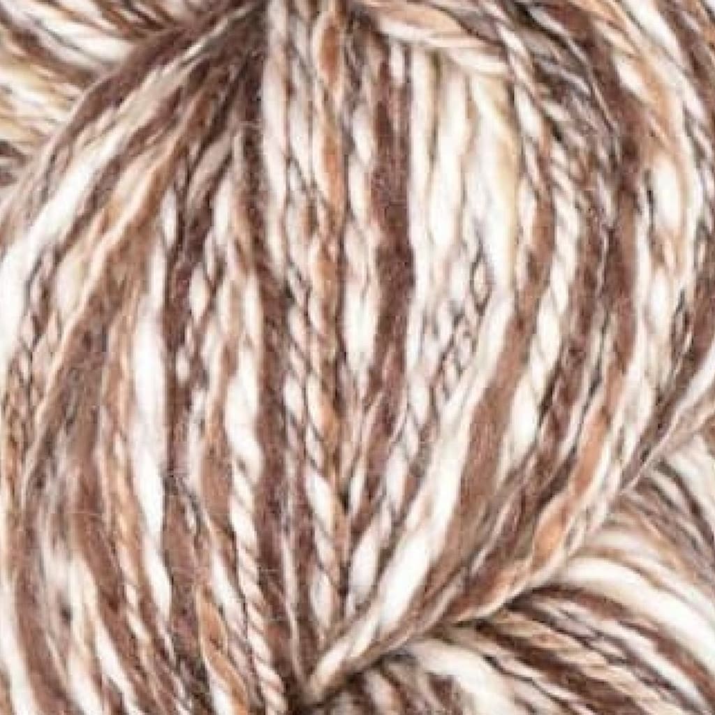 Close-up of brown, white, and tan yarn.