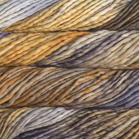 Color: Laguna Negra 861. A dark, gold, brown and gray variegated variant of Malabrigo Rasta yarn. 