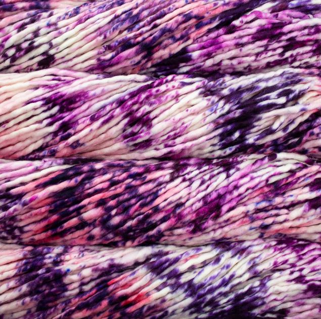 Color: Pintada Blueberry Cream 177. A purple, pink and white variant of Malabrigo Rasta yarn. 