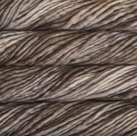 Color: Sombras 849. A light brown and tan variegated variant of Malabrigo Rasta yarn. 