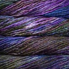 Color: Zarzamora 863. A dark purple, green and blue variegated variant of Malabrigo Rasta yarn. 