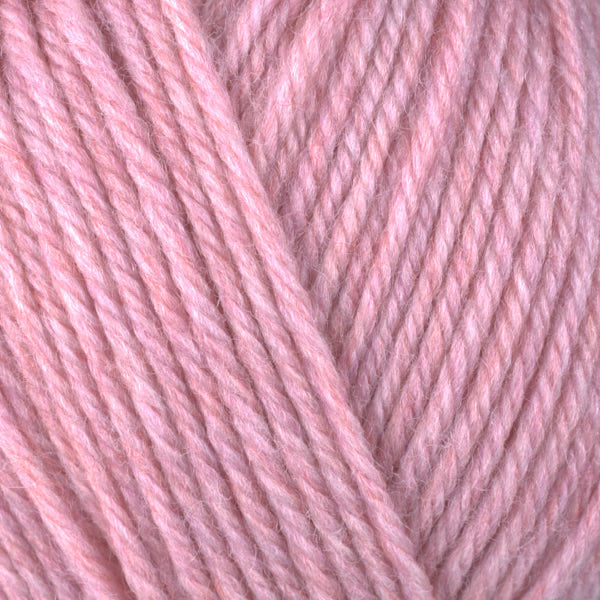 Peach 33160, a heathered warm peachy pink skein of washable worsted weight Ultra Wool yarn.