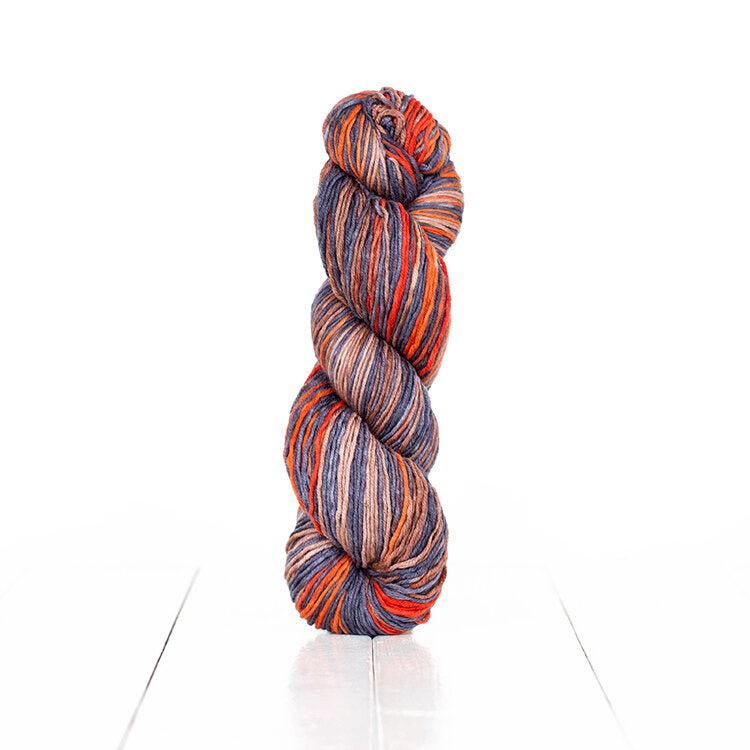Color 6021, hand-dyed yarn in self-striping shades of oranges, greys, and browns..