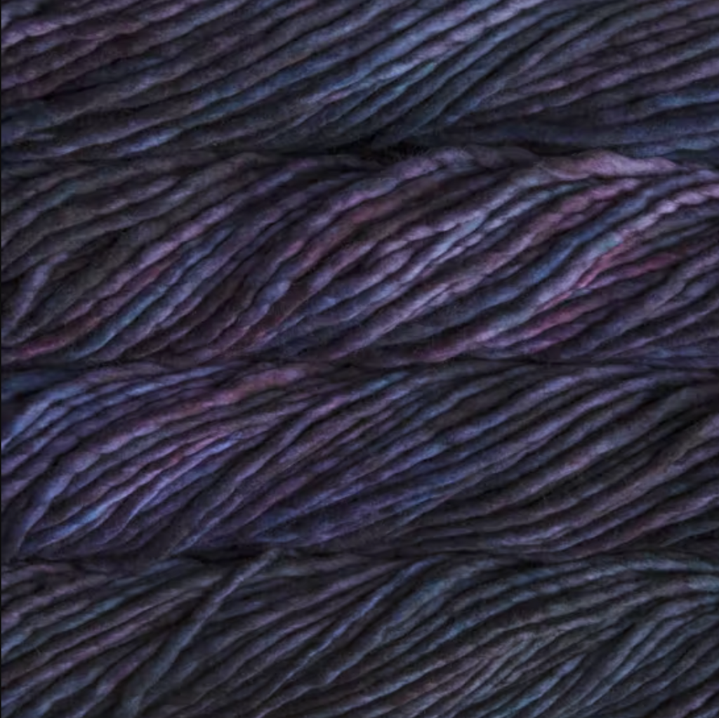 Color: Whales Road 247. A dark blue and dark purple variegated variant of Malabrigo Rasta yarn. 