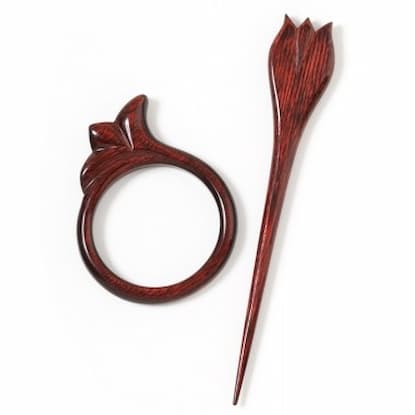 Wooden ring and stick pin with tulip accents on top of stick pin.