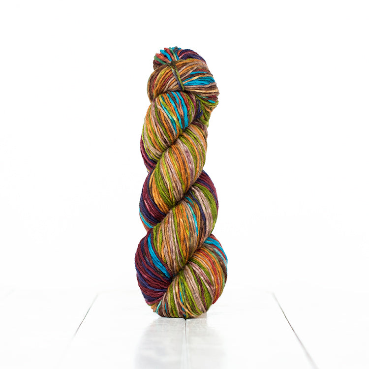 Color 6002, hand-dyed self-striping yarn in dark burgundy, bright blue, & warm earth tones.