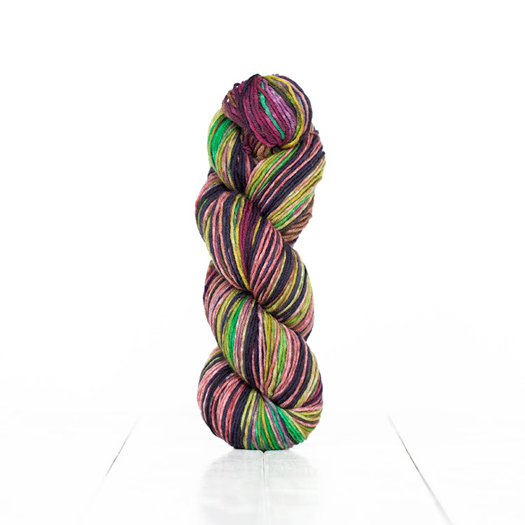 Color 6018, hand-dyed yarn in self-striping shades of plum, mauve, and greens.