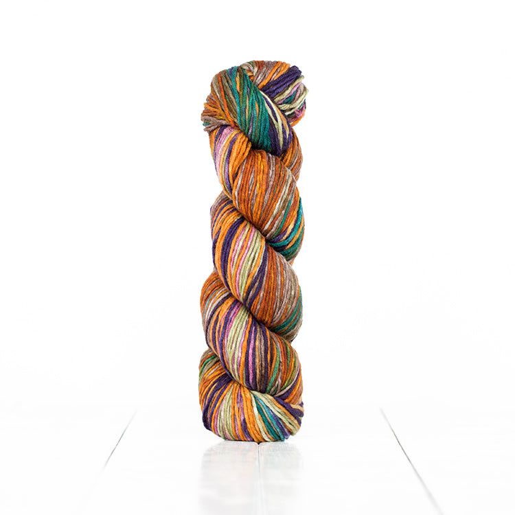 Color 6019, hand-dyed yarn in self-striping shades of soft orange, rust, pink, teal, & eggplant.