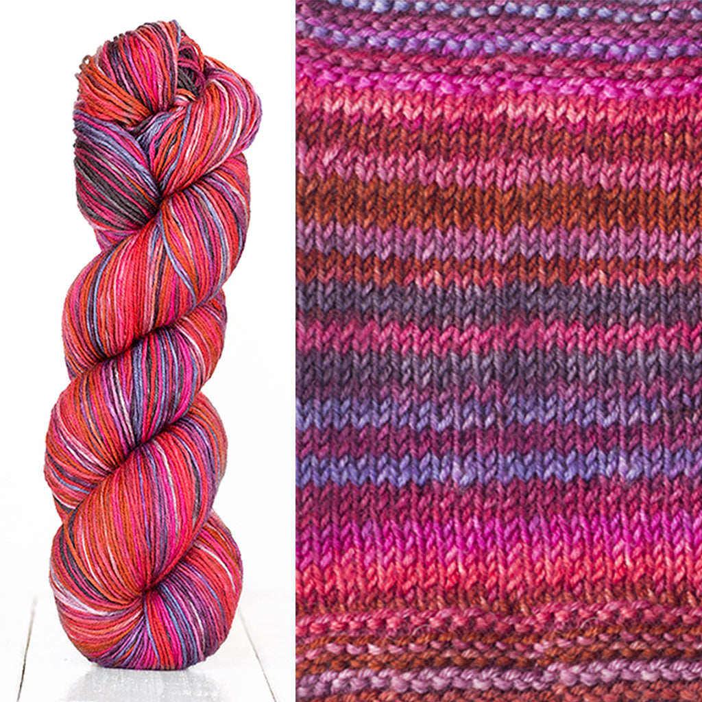 Color 3005: a hand-dyed skein of self striping wool yarn with pink, red, purple, and brown shades