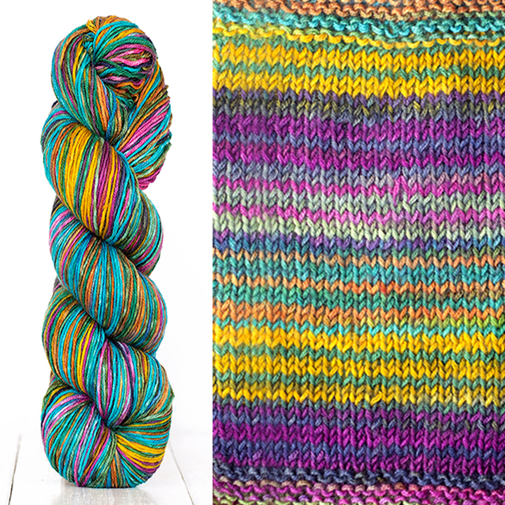 Color 3010: a hand-dyed skein of self striping wool yarn with purple, yellow, white, and green shade