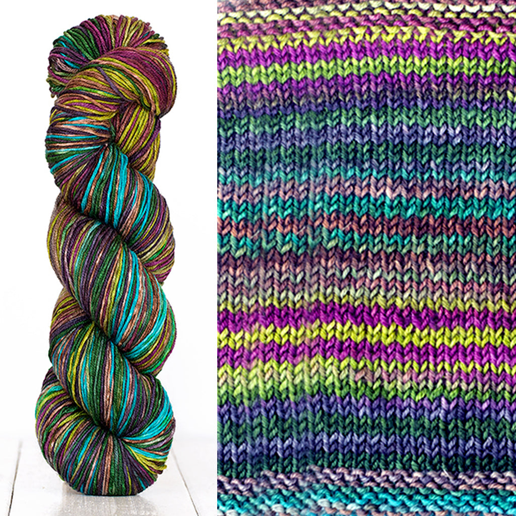 Color 3012: a hand-dyed skein of self striping wool yarn with blue, purple, green, and yellow shades