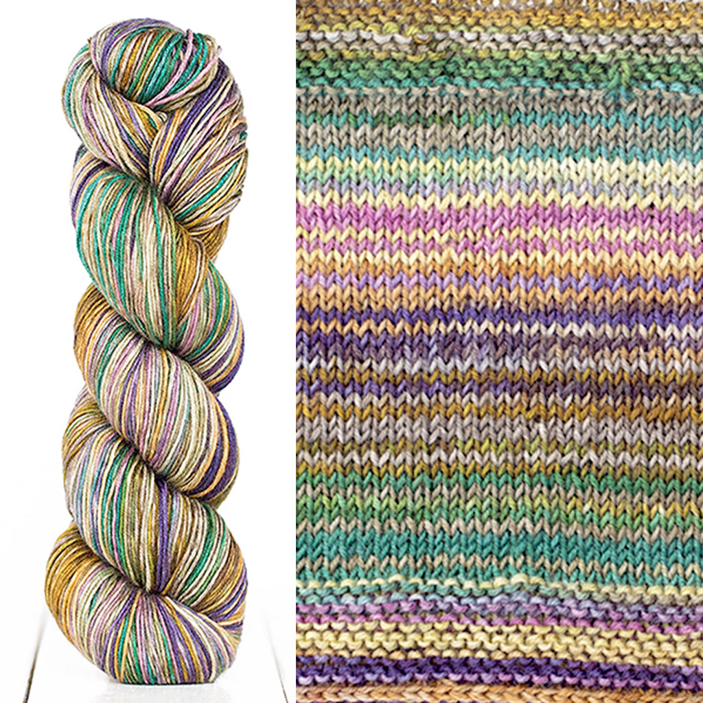 Color 3019: a hand-dyed skein of self striping wool yarn with purple, yellow, green, and tan shade