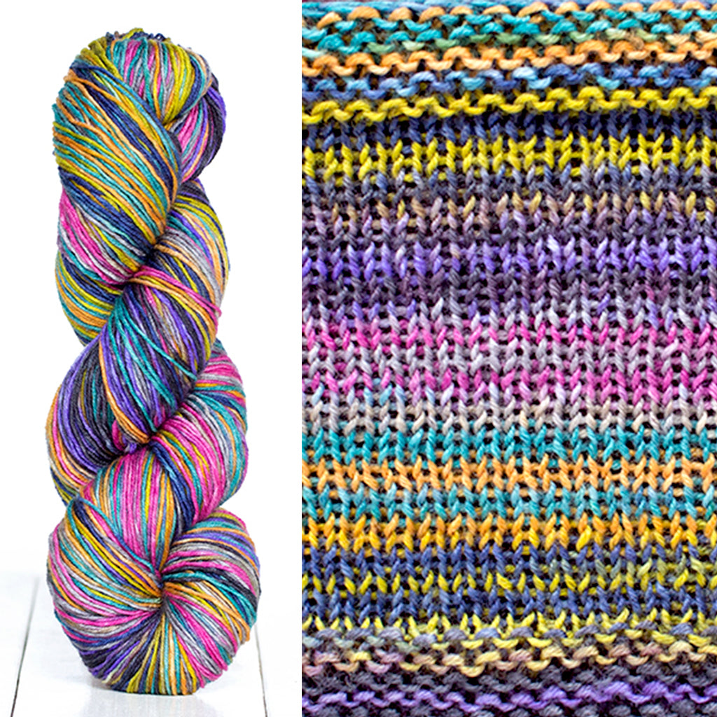 Color 3022: a hand-dyed skein of self striping wool yarn with blue, yellow, pink, and purple shades