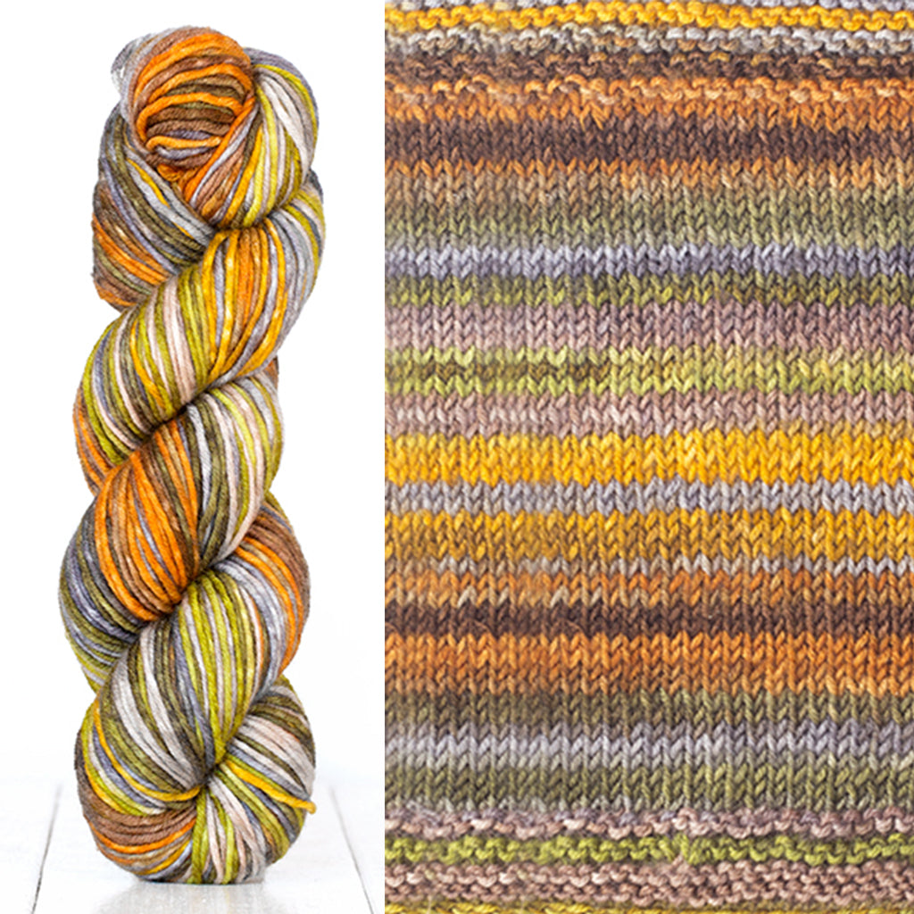 Color 4001: a hand-dyed skein of self striping wool yarn with orange, grey, white, and yellow shades