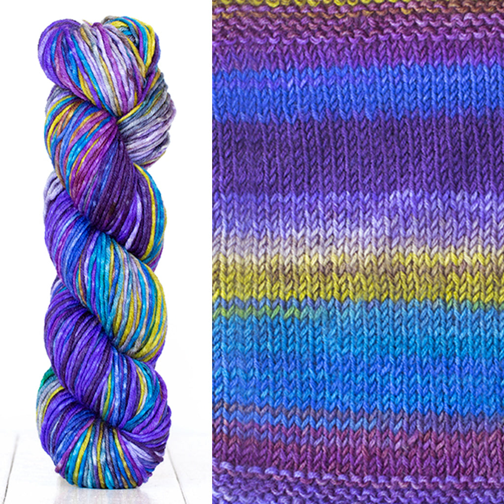 Color 4003: a hand-dyed skein of self striping wool yarn with blue, purple, white, and yellow shades
