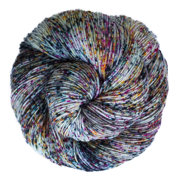 Malabrigo Sock Yarn in Baco - A speckled colorway in white, purple, yellow and green