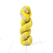 PAN21, a limited edition self striping yellow and grey DK weight yarn inspired by Pantone's 2021 colors of the year.