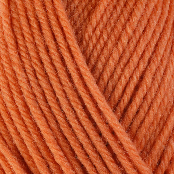 Bittersweet 3328, a soft yellow-orange skein of washable worsted weight Ultra Wool yarn.