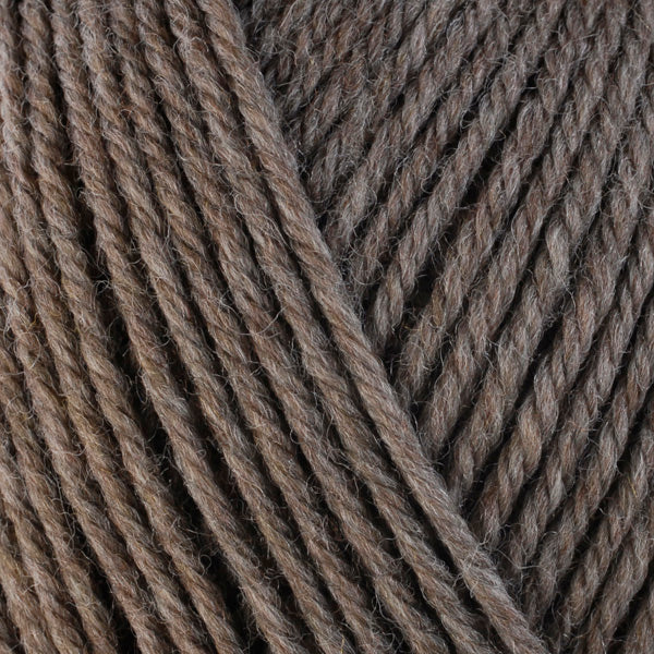 Driftwood 33104, a natural light brown skein of washable worsted weight Ultra Wool yarn.