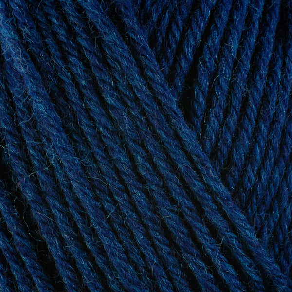 Ocean 33152, a dark blue blue skein of washable worsted weight Ultra Wool yarn.