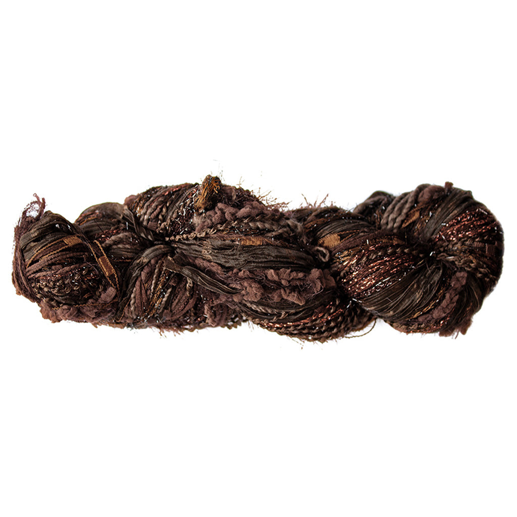 Color 505, a skein of warm earthy brown yarn, full of texture and sparkle.