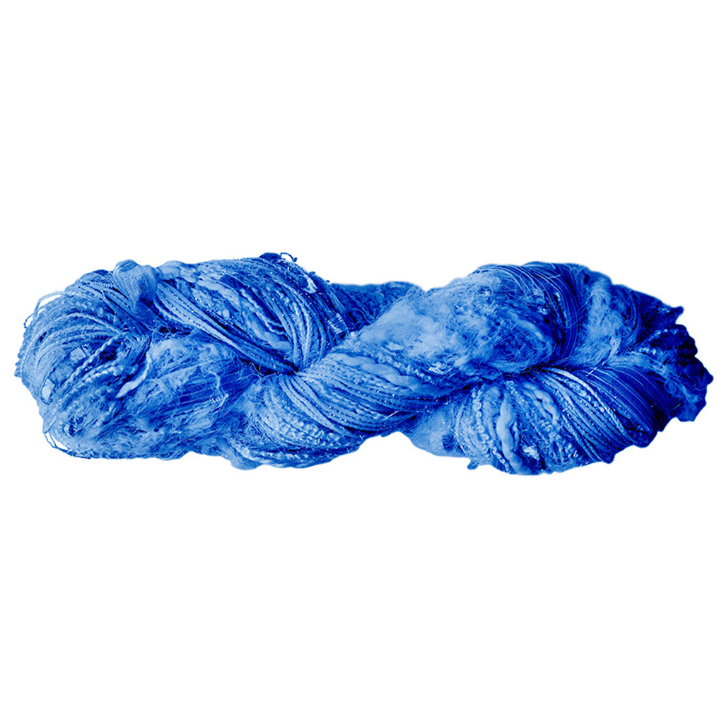 Color 511, a skein of sky blue yarn, full of texture and sparkle.