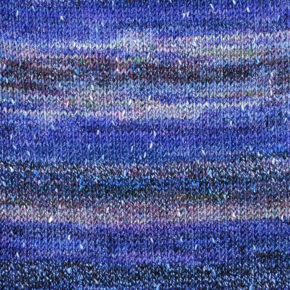 Orchid 7418. A self striping yarn with white, purple. light and dark blue.