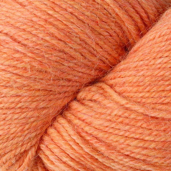 Grove Mix 62180, a heathered light orange skein of Ultra Alpaca Worsted.