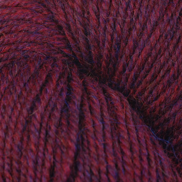Garnet Mix 62183, a heathered red skein of Ultra Alpaca Worsted.