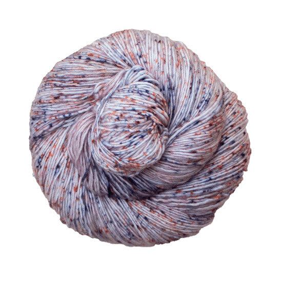 Malabrigo Mechita Fairytale Yarn - a white yarn speckled with orange and blue