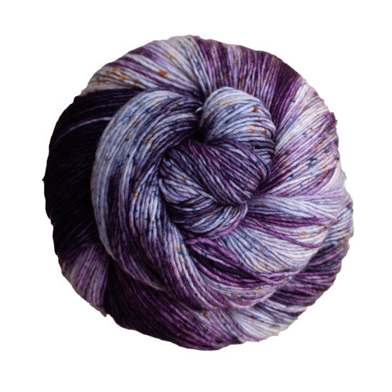 Malabrigo Mechita Ursula Yarn - a light and dark purple colorway with specks of yellow and blue