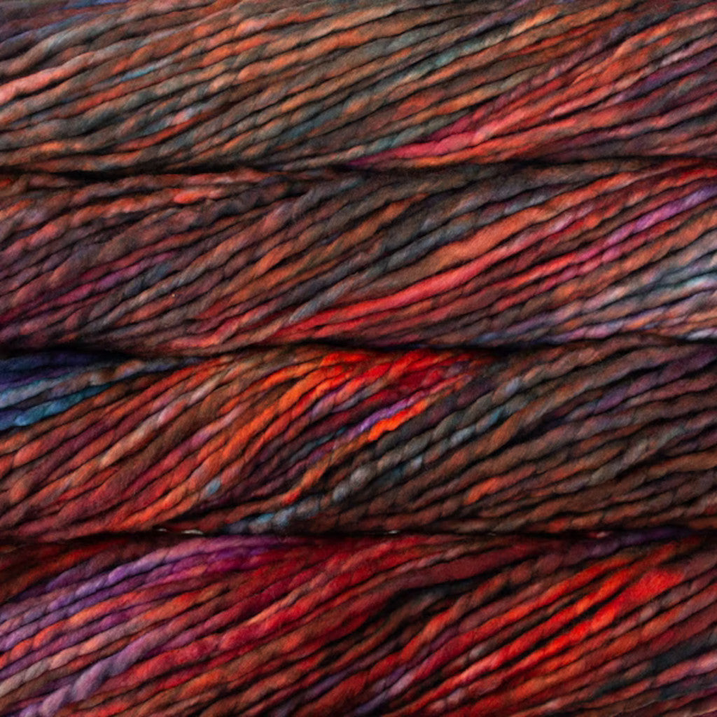 Color: Marte 121. A variegated red and brown variant of Malabrigo Rasta yarn. 