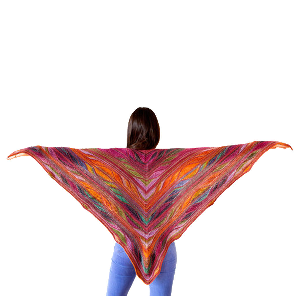 Model wearing the Butterfly Papillon Shawl Pattern in the shades red, orange, and pink.