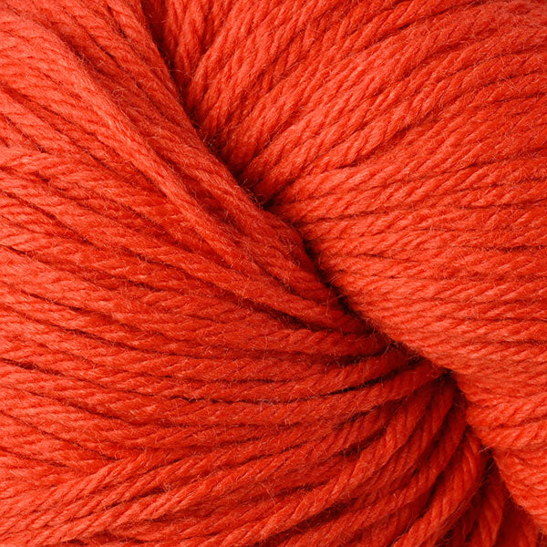 Berroco Vintage Worsted weight yarn in the color Orange 5140, a very vibrant orange.