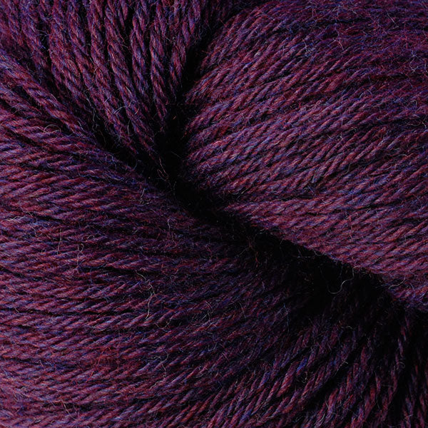 Berroco Vintage Worsted weight yarn in the color Dried Plum 5180, a dark purple heather.