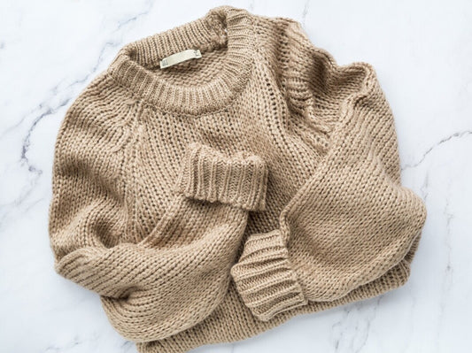 beige knitted sweater made from the best yarn for sweaters