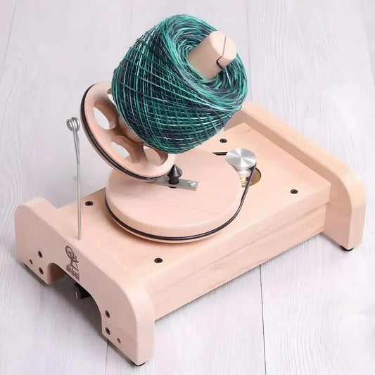 wooden yarn winder with thread on it as an example of an option for the best yarn winder
