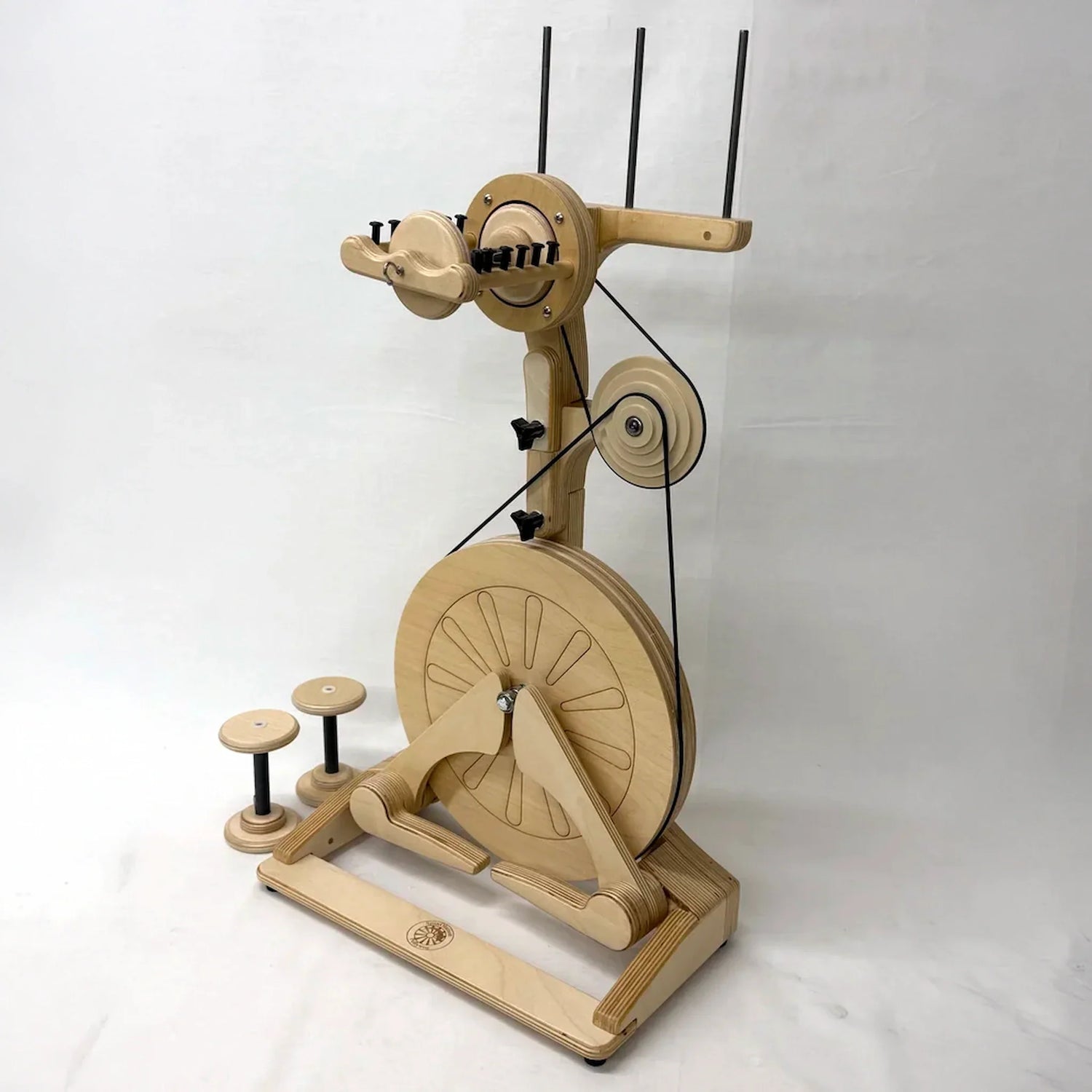 SpinOlution Pollywog wheel shown with an accelerator and bobbins