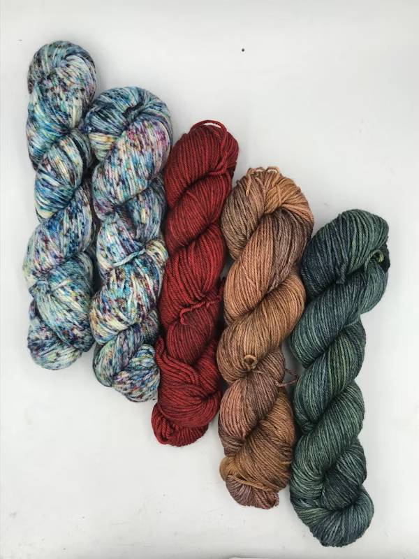 Five skeins of colorful yarn.