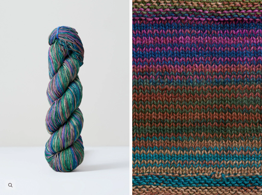 Color 1071: a hand-dyed skein of self striping cotton yarn with purple, green, blue, and grey shades