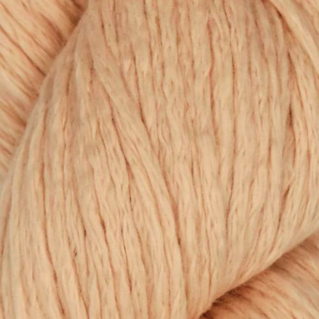 Close up of Juniper Moon Farm Cumulus in colorway Pastel Orange