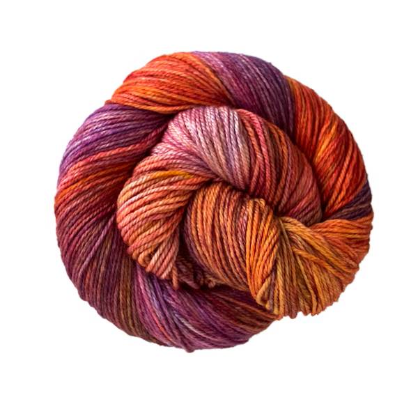 Ball of colorful orange and purple yarn.